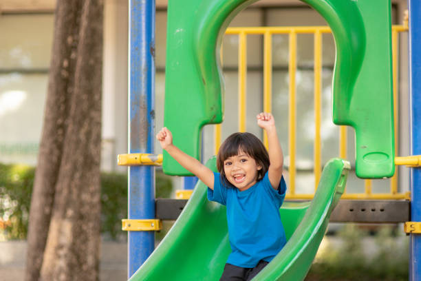 istock Active little girl on playground 1328190221