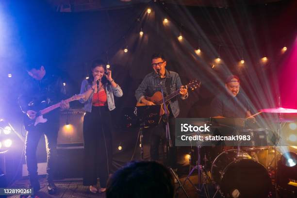 Musicians In Concert Stock Photo - Download Image Now - Performance Group, Stage - Performance Space, Acoustic Music