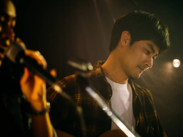 istock Young couple performing the music on the stage. 1328190322