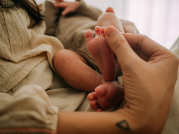 istock Mother with newborn baby 1328191109