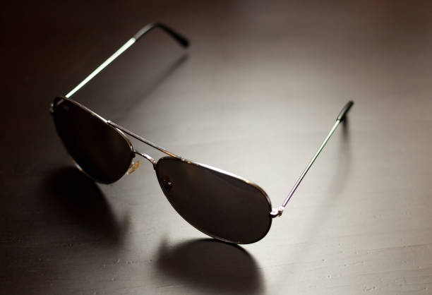 istock sunglasses on a wooden table 1328193538