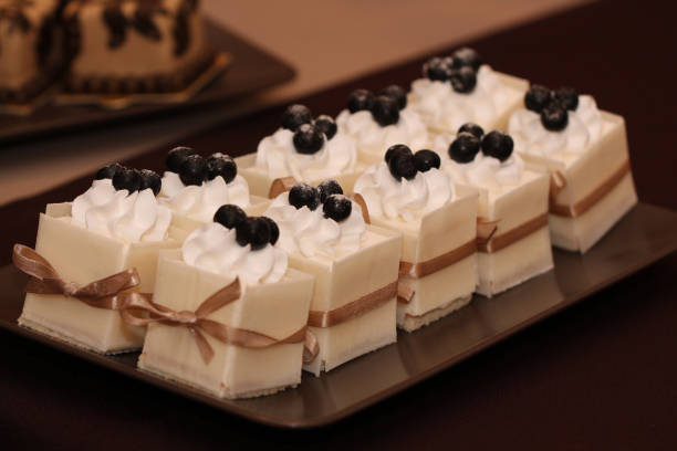 Set of different beautiful and tasty pastries on a plate.​