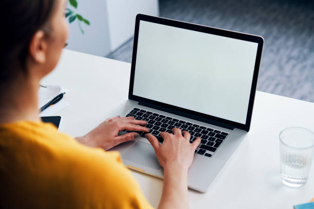 istock Woman working on laptop mock-up with blank copy space screen 1328200256