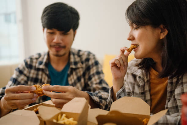 istock Asian couple having lunch at home during quarantine. 1328201482