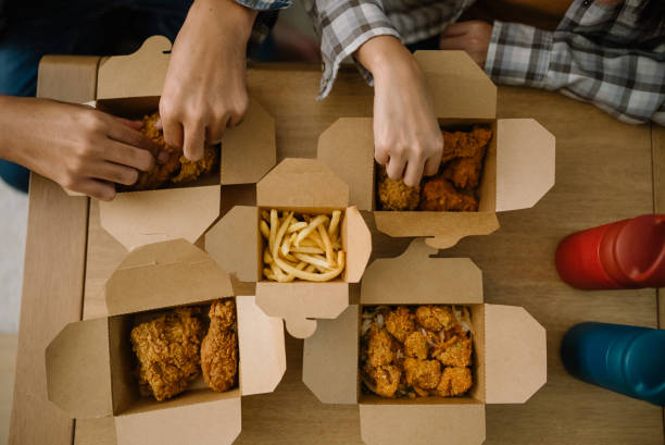 Asian couple having lunch at home, Food delivery service at home.