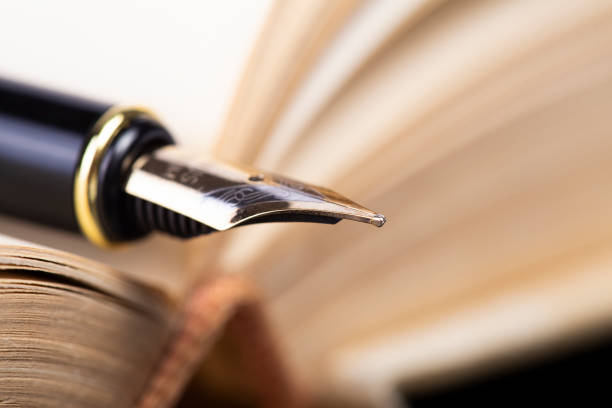 Open book and fountain pen