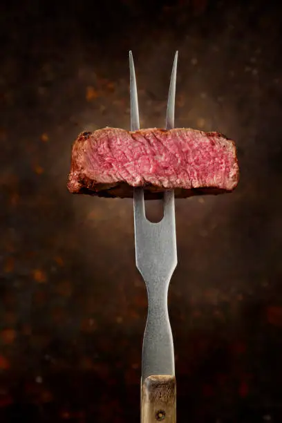 Perfect Medium Rare Top Sirloin Steak Being Seasoned with Maldon Salt