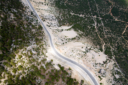 A green pass road from above