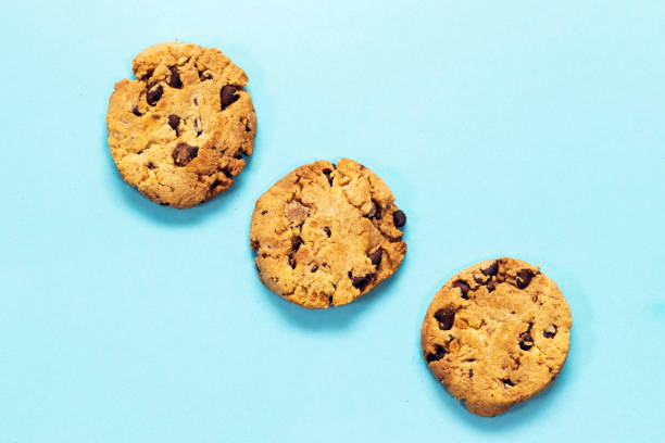istock Chocolate Chip Cookies isolated on blue background 1328215890