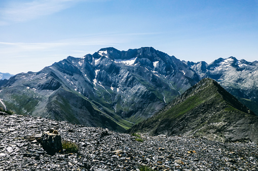 scree of white stones in the valley in the mountains in summer