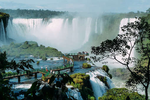 Tourists at Iguazu Falls, one of the world's great natural wonders, near the border of Argentina and Brazil.