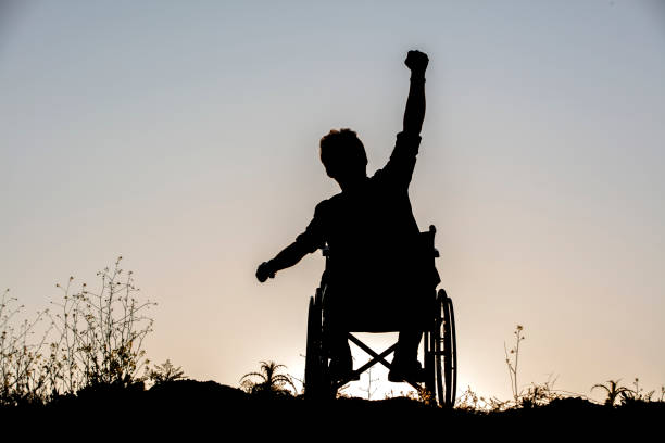 istock Disability man success on wheelchair 1328217581