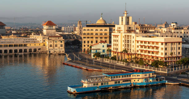 Havana Cuba cruise ship port as the sun is rising View front the top of a cruise ship as it is entering terminal sierra in Havan Cuba. old havana stock pictures, royalty-free photos & images