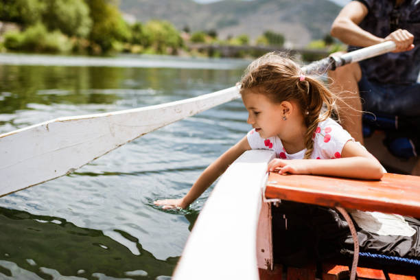 istock Young girl enjoying boat ride 1328221690