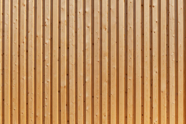 Wooden fence painted a light brown color.