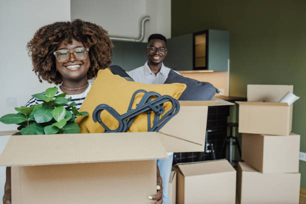 istock Young couple is moving in new apartment 1328223242