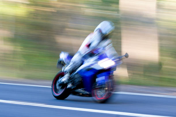istock Speeding motorcycle on highway, blurred motion, background with copy space 1328224050