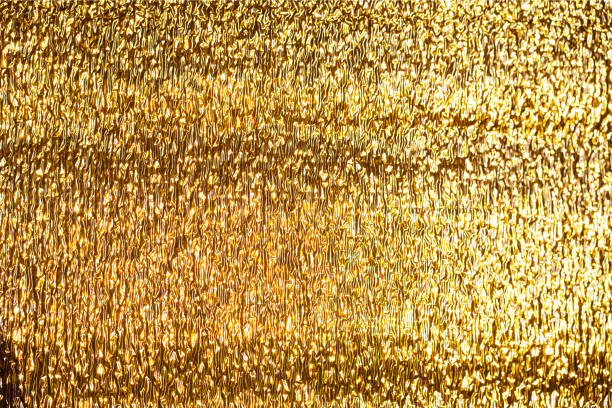 istock Gold textured image background. Shiny, golden surface. Abstract glowing texture. 1328229334