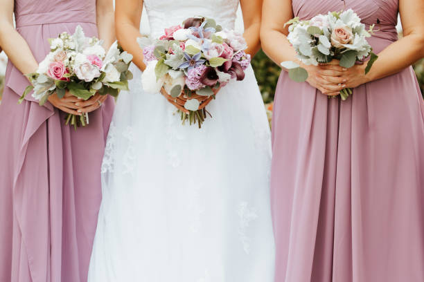 istock Bridesmaids bouquets close up 1328241090