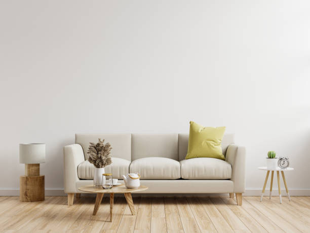istock Living room interior wall mockup with sofa with decor on white background. 1328243906