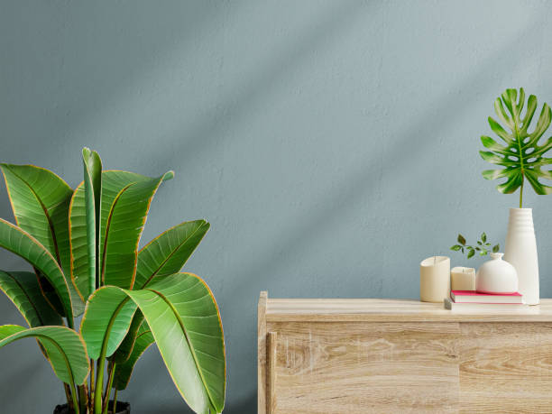 istock Interior wall mockup with green plant,Dark blue wall and shelf. 1328243935