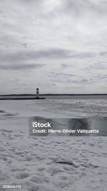 Snowcovered Shore Of The Quai Du Phare De Lachine Stock Photo - Download Image Now