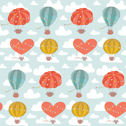 Childish cute seamless pattern with Hot Air Balloon flying in the sky on a light blue background with white clouds. Flat hand drawn vector illustration