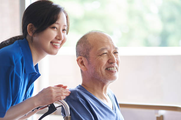 istock Wheelchair-riding elderly and caregivers 1328248268