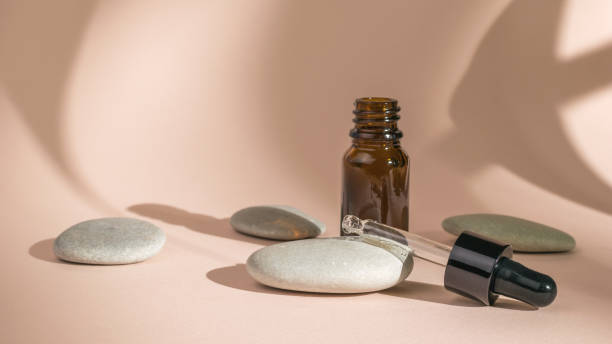 istock A medicine bottle with a pipette and stones on a beige background. 1328250037