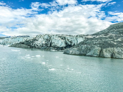 A stunning view is played out in South Central Alaska. Glacial waters and rising mountains create scenic beauty. The frigid waters of Prince William Sound, near Valdez, Alaska  creates a surreal view of Alaska.