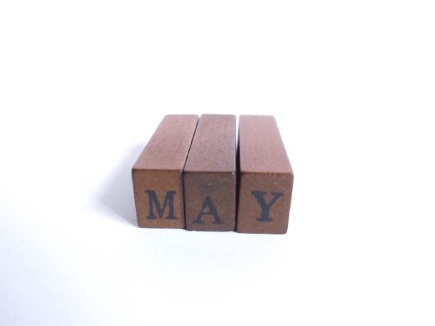 istock May month word text from wooden blocks 1328257245