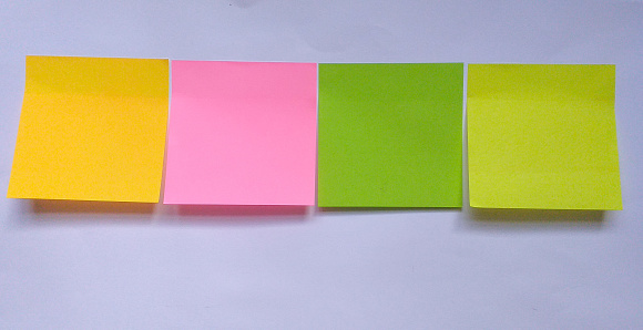 blank pastel yellow sticky notes packaging on white background. Discussing business, teamwork, brainstorming concept. sticky notes paper with shadow. copy space