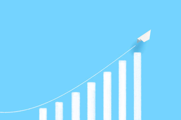 istock A rapidly growing bar chart and a paper airplane flying over it. 1328260865
