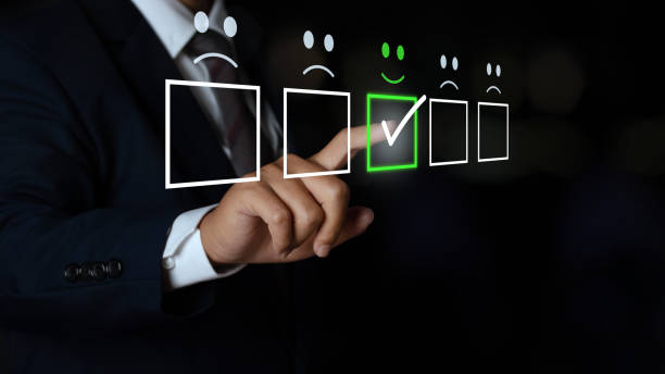 istock business man touching the virtual screen on the smiley face icon on the digital touch screen. Customer service evaluation concept. 1328263732