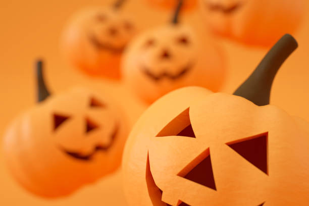 istock Pumpkins for Halloween with spooky face, Jack O' Lantern, Orange Color Background 1328267406