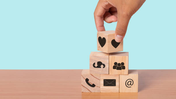 istock Hand arranging wood block with icon contact. Customer service mind and Customer support service contact us concept. copy space 1328267654