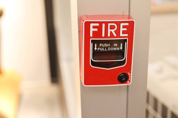 istock Fire alarm switch on the factory wall. 1328267765