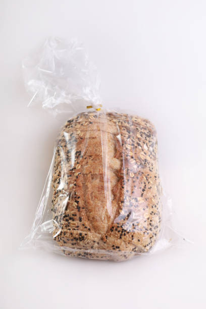 istock Sliced bread in a transparent plastic bag on white background 1328268425
