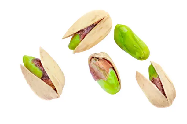 Pistachios isolated on white background, top view.  Pistachios nuts Flat lay. Creative layout"n