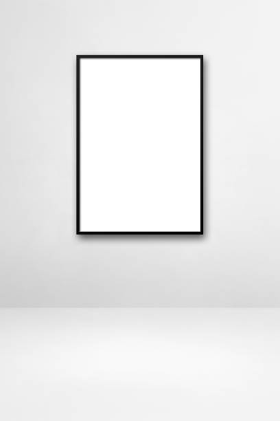 istock Black picture frame hanging on a white wall 1328269770