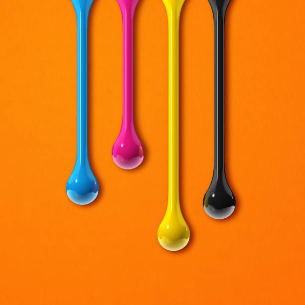 istock cmyk ink drops on orange paper square background 1328269803