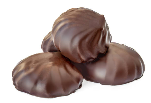 istock Chocolate marshmallows isolated on white background. Merengue Marshmallow Zephyr candy close up