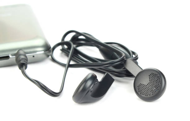istock Black Earphone and Smartphone equipment set isolated on white background:selective focus 1328276869
