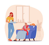 istock Elderly Caregiving Concept. Young Female Character Bringing Medicine to Old Woman. Help to Seniors during Pandemic 1328278415