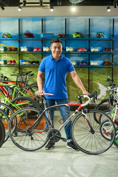 istock Salesman Selling Bicycle 1328280798