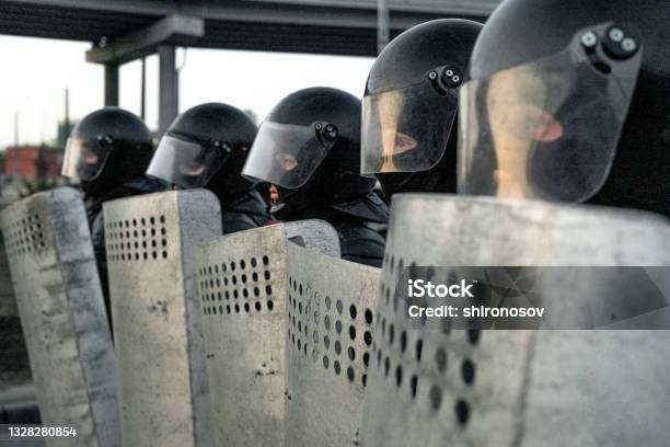 Police Squad Protecting Against Riot Stock Photo - Download Image Now - Riot, Russia, Protest
