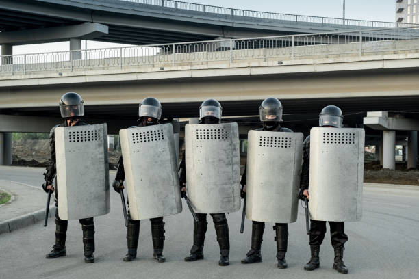 istock Group of police guards standing in row 1328280959