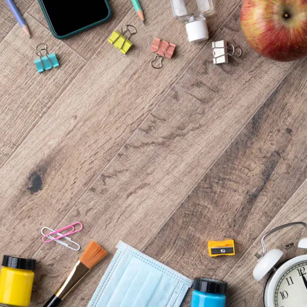 Photo of Back to school design concept with stationery over wooden table background.