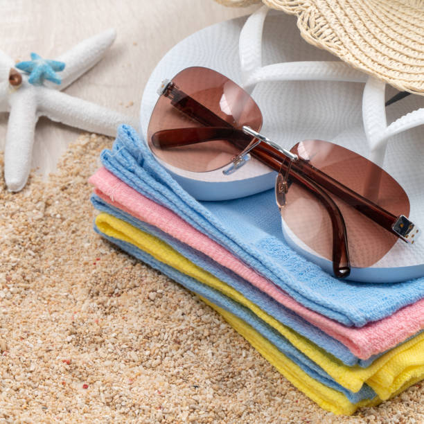 istock Summer beach background design concept with accessories on white table background. 1328281030
