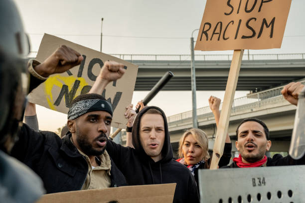 istock Activists giving speech against racism at square 1328281682